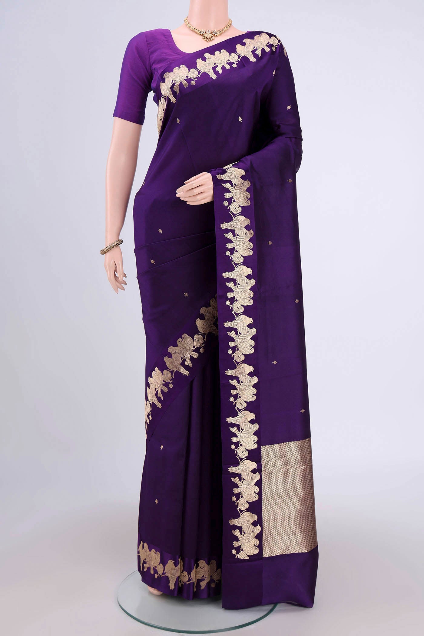 Purple Banarasi Katan Silk Saree with Zari Butta on the body and Zari Border.  displayed on a mannequin