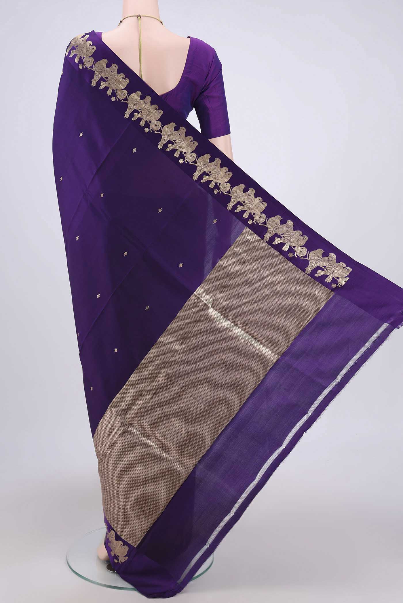 Flat view of Purple Banarasi Katan Silk Saree with Zari Butta on the body and Zari Border. 