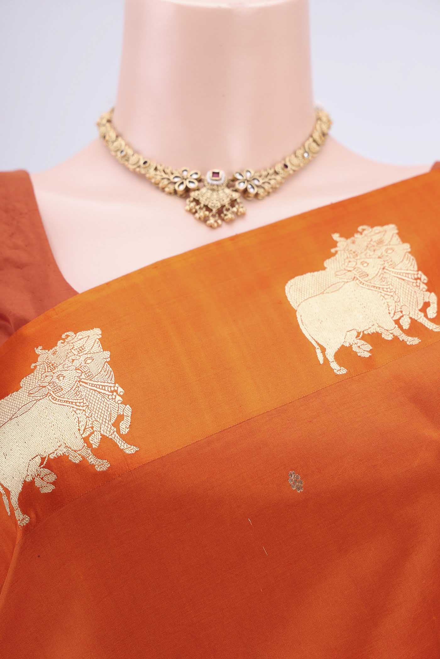 Border image of Orange Banarasi Katan Silk Saree with Zari Butta on the body and Zari Border. 