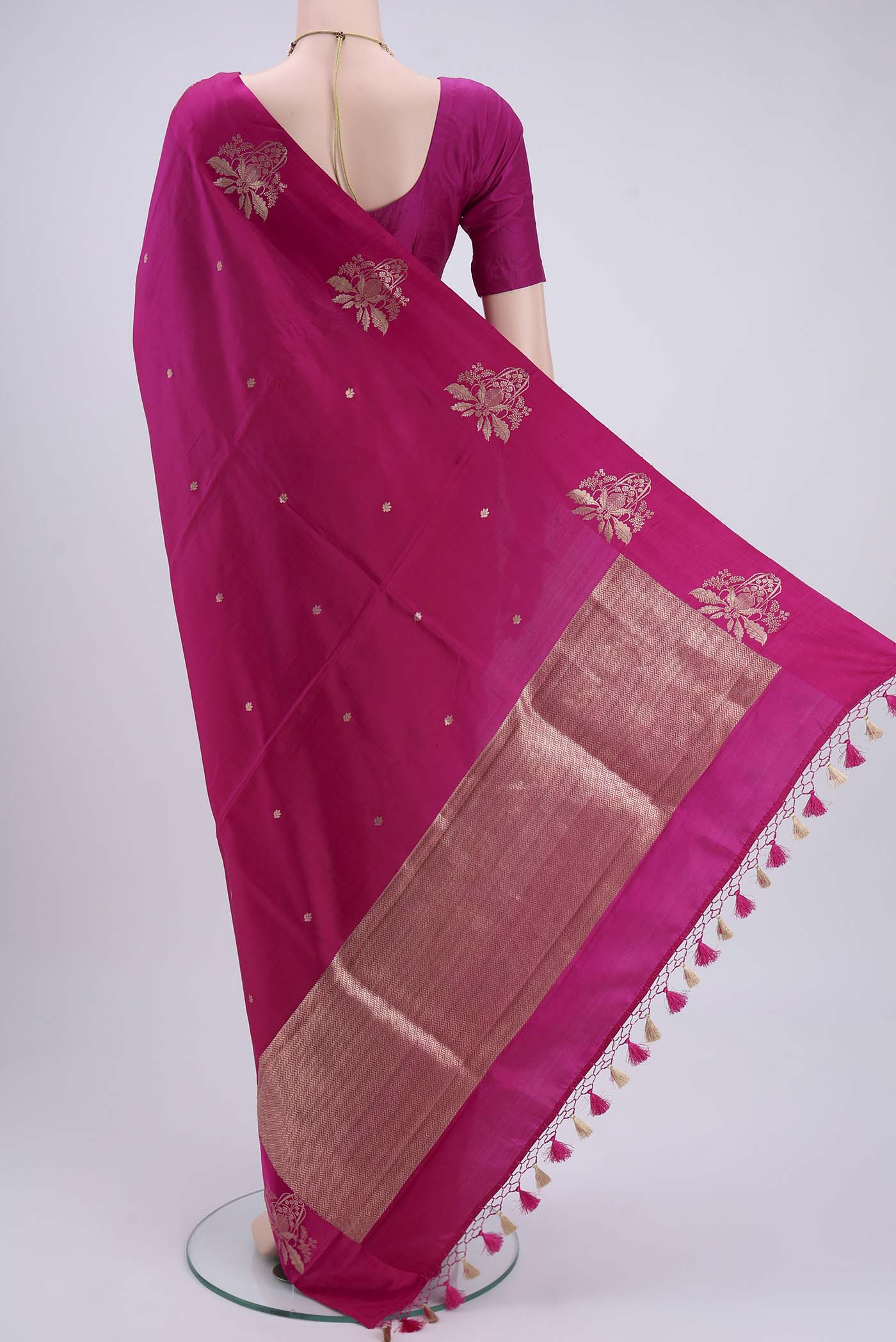Flat view of Rani Pink Banarasi Katan Silk Saree with Zari Butta on the body and Thin Zari Line. 