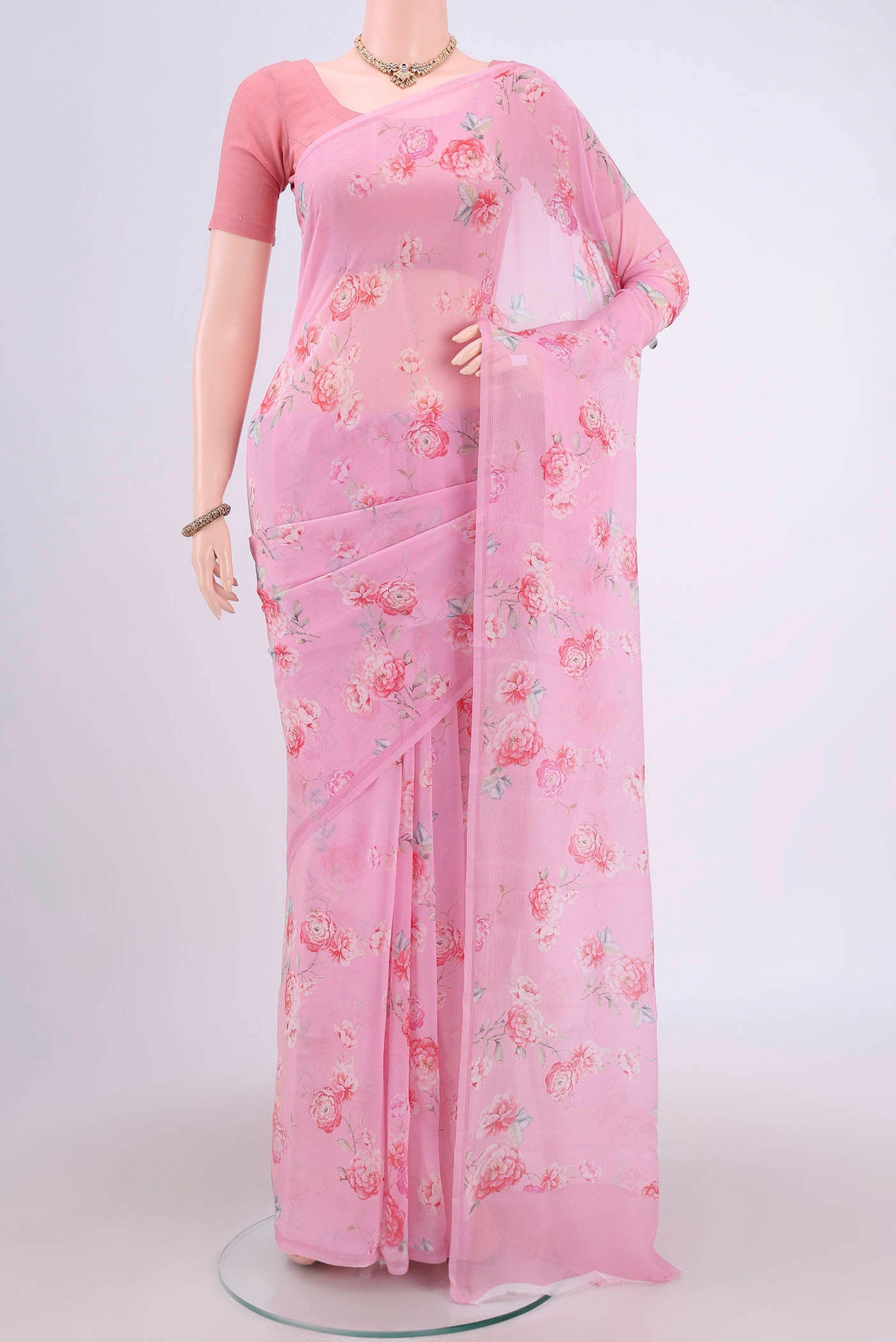 Pink Mysore Chiffon Saree with Floral Print on the body and Zari Border.  displayed on a mannequin