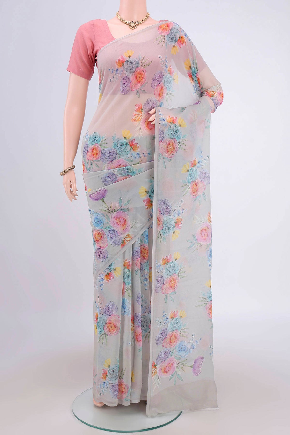 Grey Mysore Chiffon Saree with Floral Print on the body and Zari Border.  displayed on a mannequin