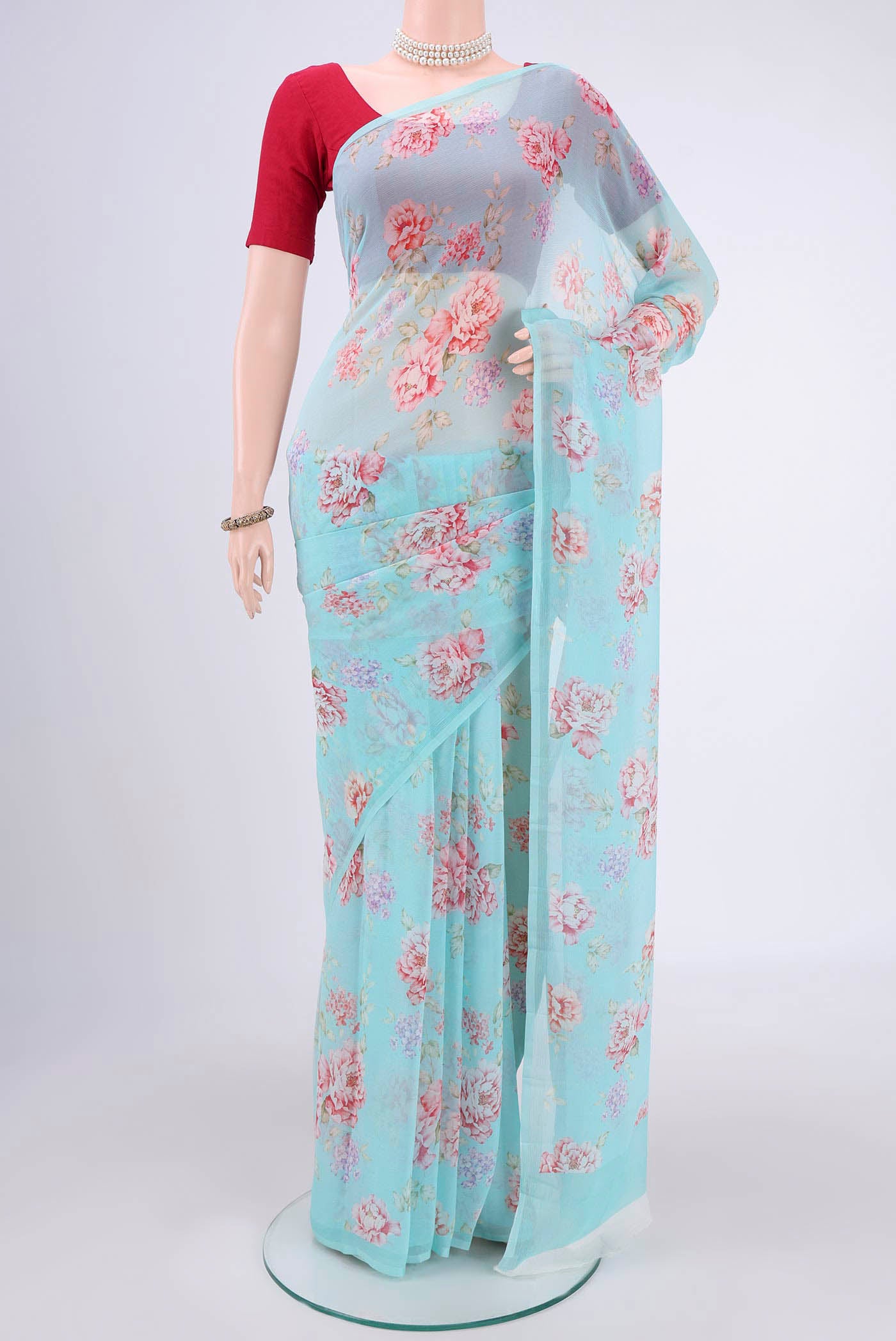 Sky Blue Mysore Chiffon Saree with Floral Print on the body and Without Border.  displayed on a mannequin