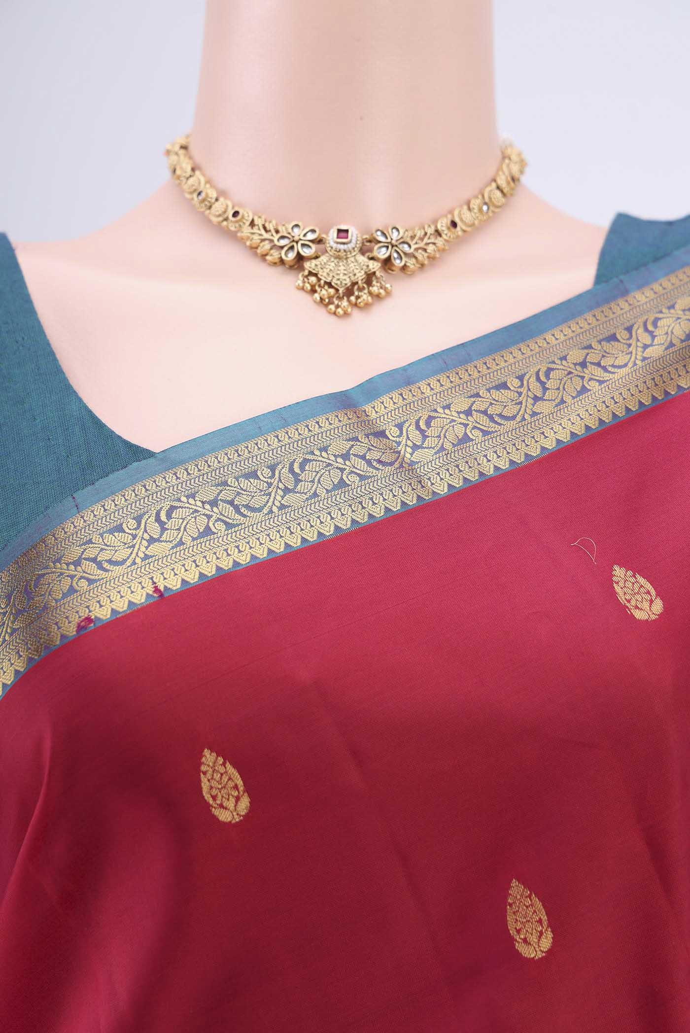 Border image of Maroon Dual Tone Kanjivaram Saree with Zari Butta on the body and Zari Border. 