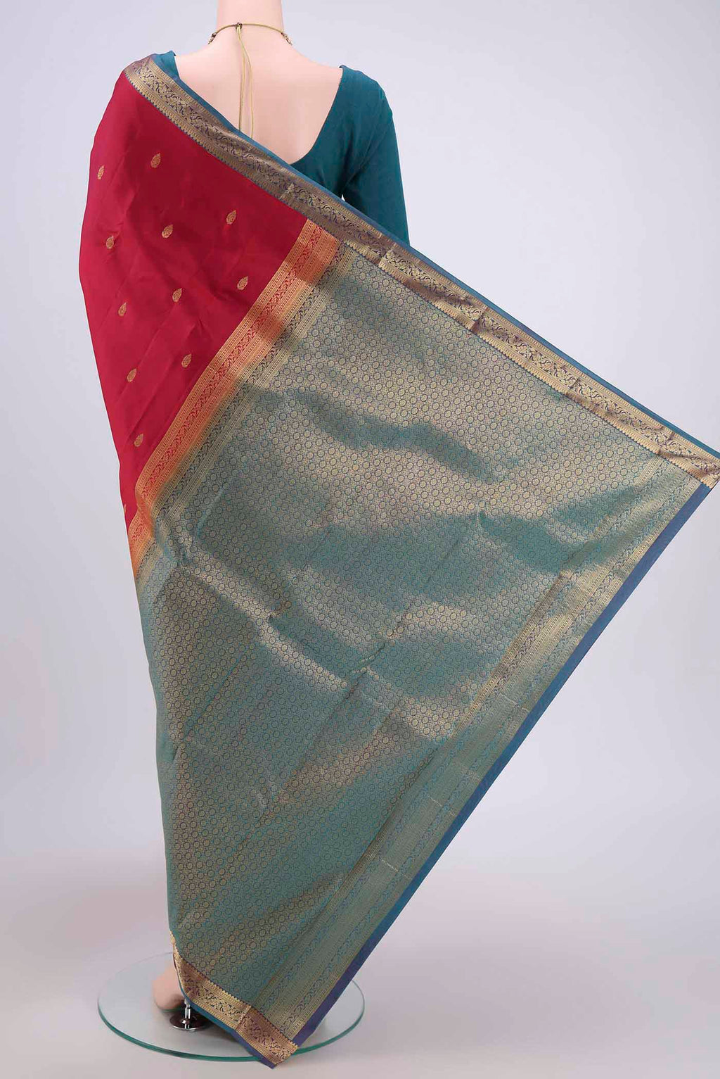 Flat view of Maroon Dual Tone Kanjivaram Saree with Zari Butta on the body and Zari Border. 