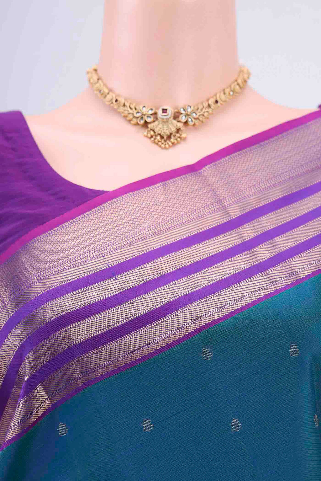 Border image of Peacock Blue Kanchipuram Saree with Zari Butta on the body and Zari Border. 