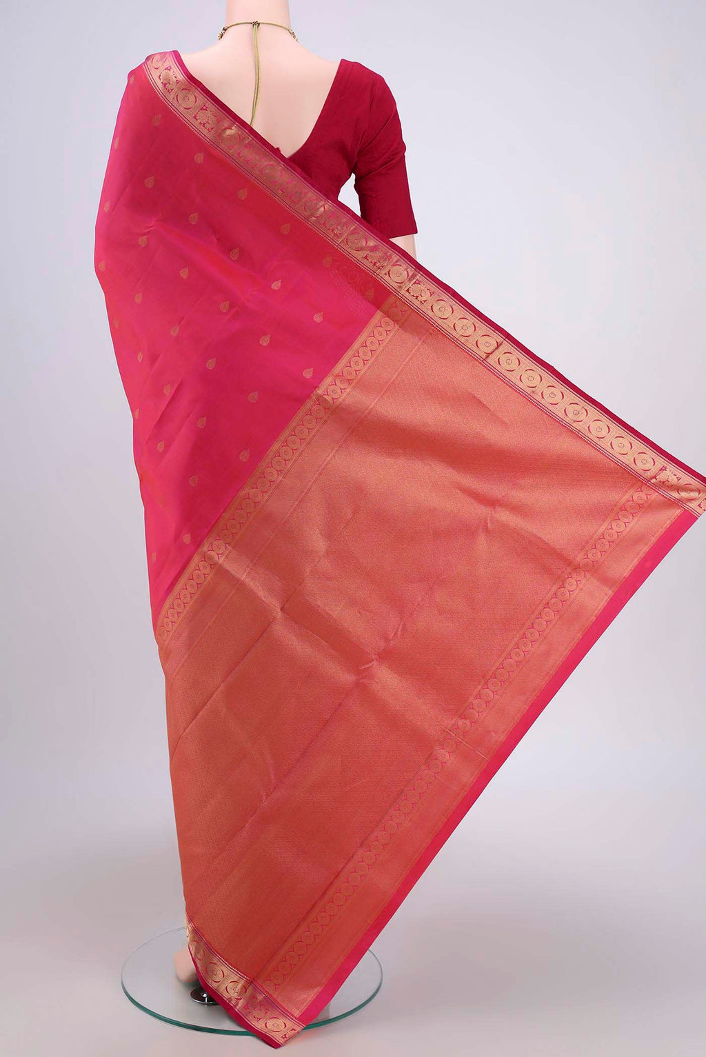 Flat view of Dark Pink Dual Tone Kanchipuram Saree with Zari Butta on the body and Zari Border. 