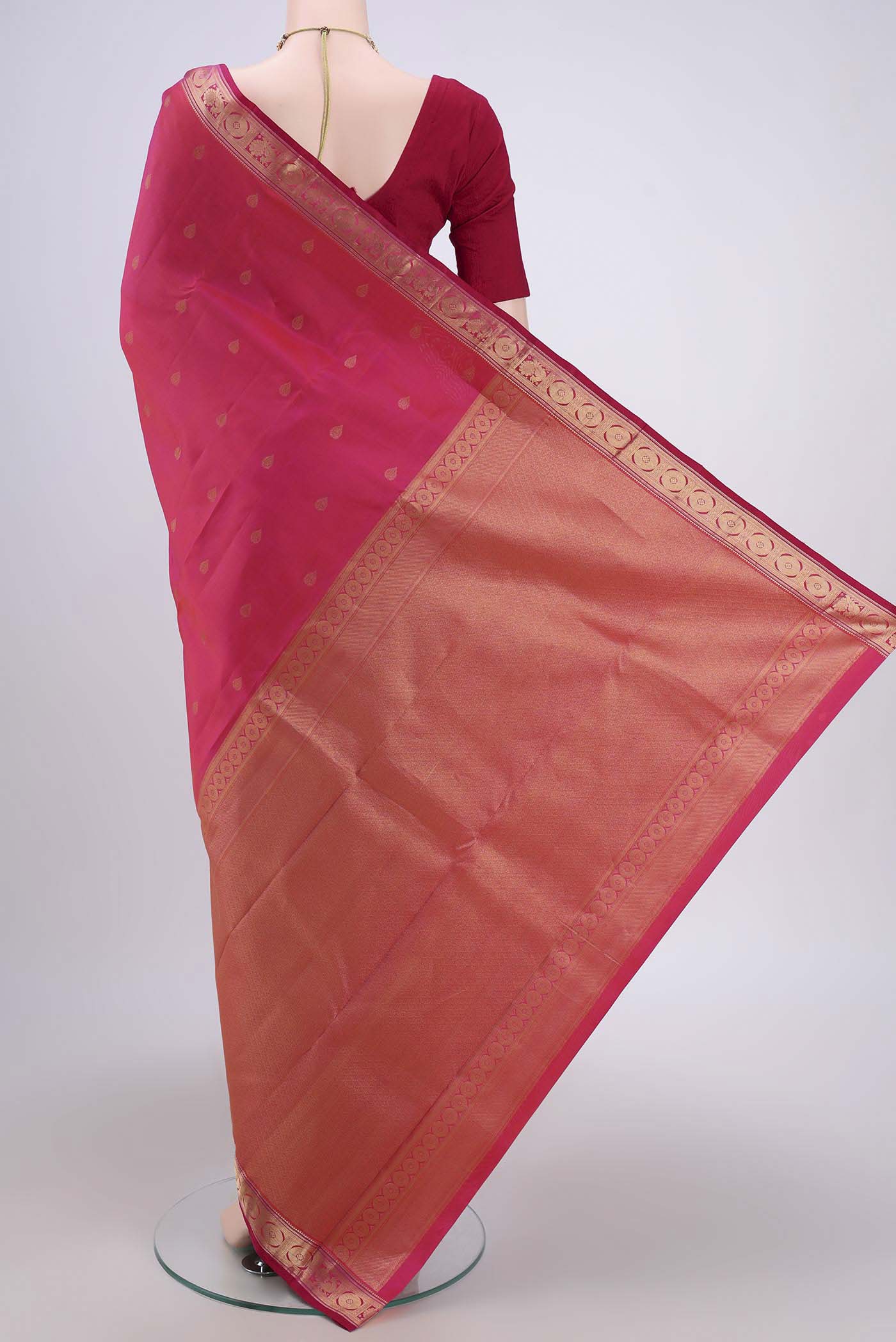 Flat view of Dark Pink Dual Tone Kanchipuram Saree with Zari Butta on the body and Zari Border. 
