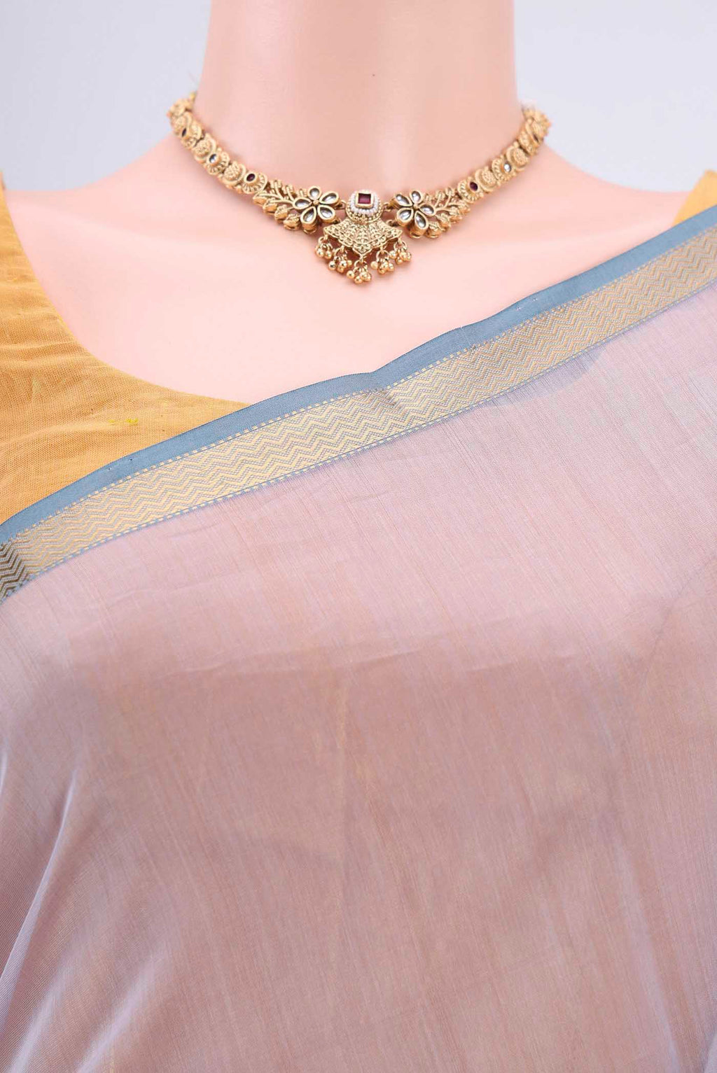 Border image of Lavender Maheshwari Silk Cotton Saree with Stripes on the body and Zari Border. 