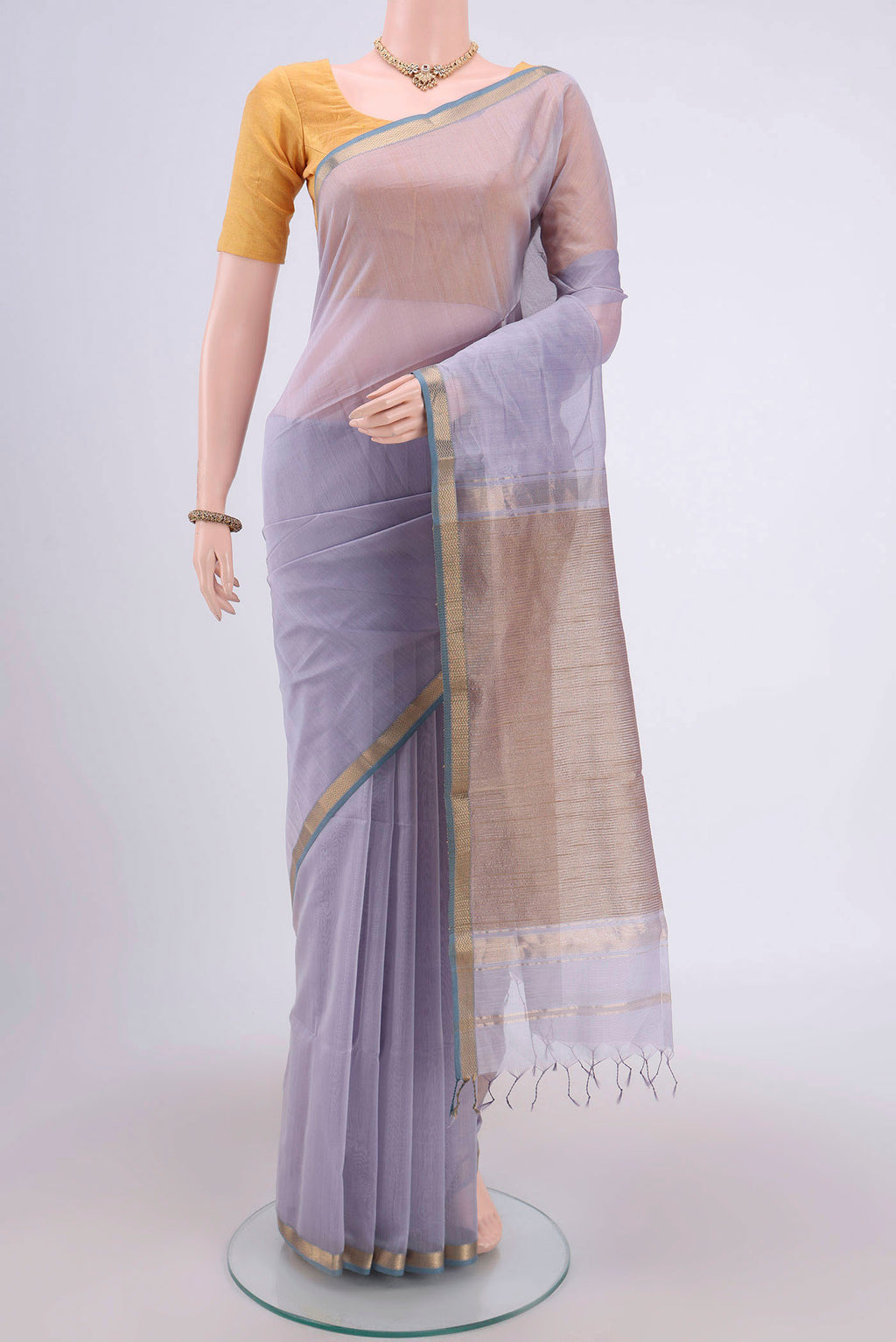 Lavender Maheshwari Silk Cotton Saree with Stripes on the body and Zari Border.  displayed on a mannequin
