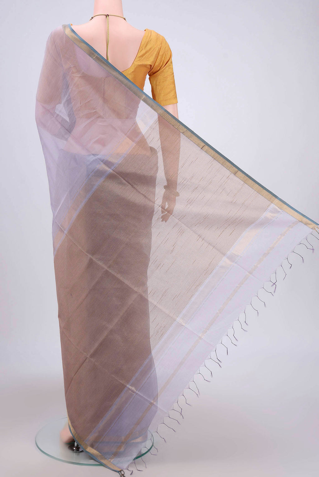 Flat view of Lavender Maheshwari Silk Cotton Saree with Stripes on the body and Zari Border. 