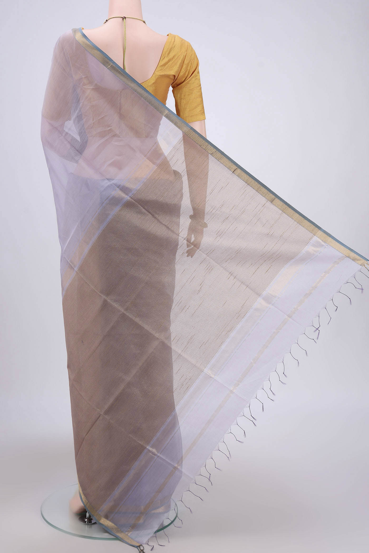 Flat view of Lavender Maheshwari Silk Cotton Saree with Stripes on the body and Zari Border. 