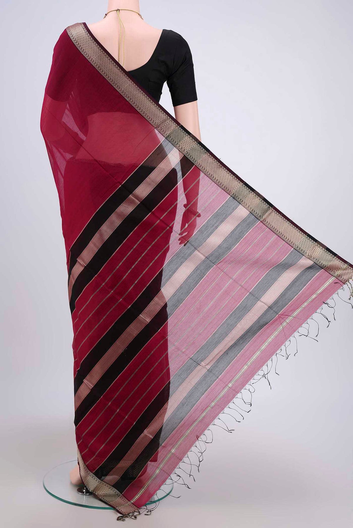 Flat view of Dark Pink Maheshwari Silk Cotton Saree with Plain Body and Zari Border. 