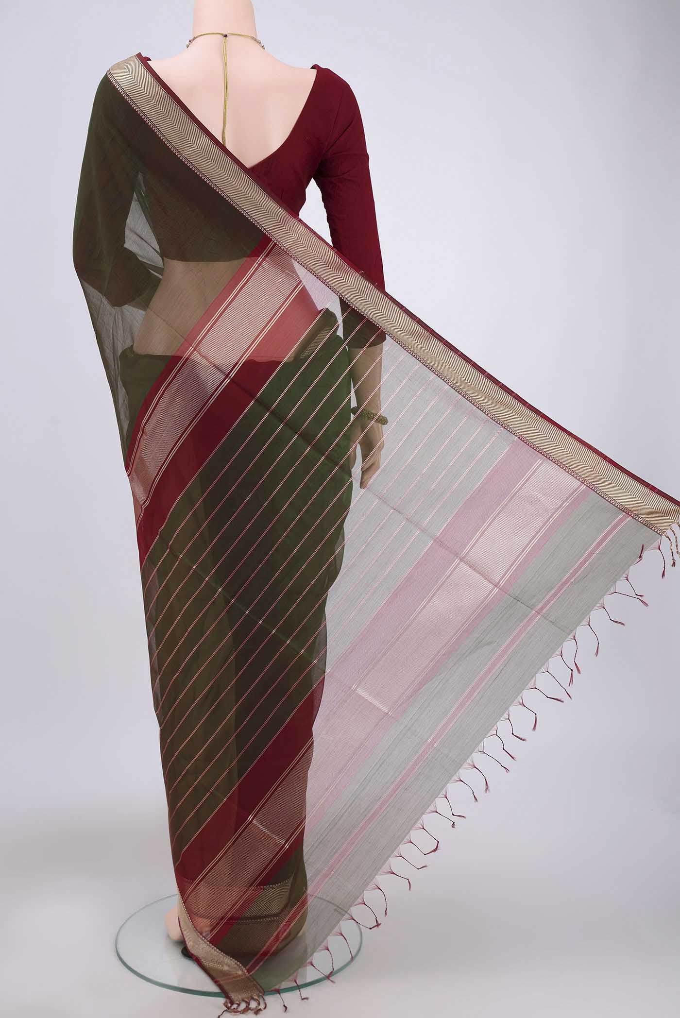 Flat view of Green Maheshwari Silk Cotton Saree with Plain Body and Zari Border. 