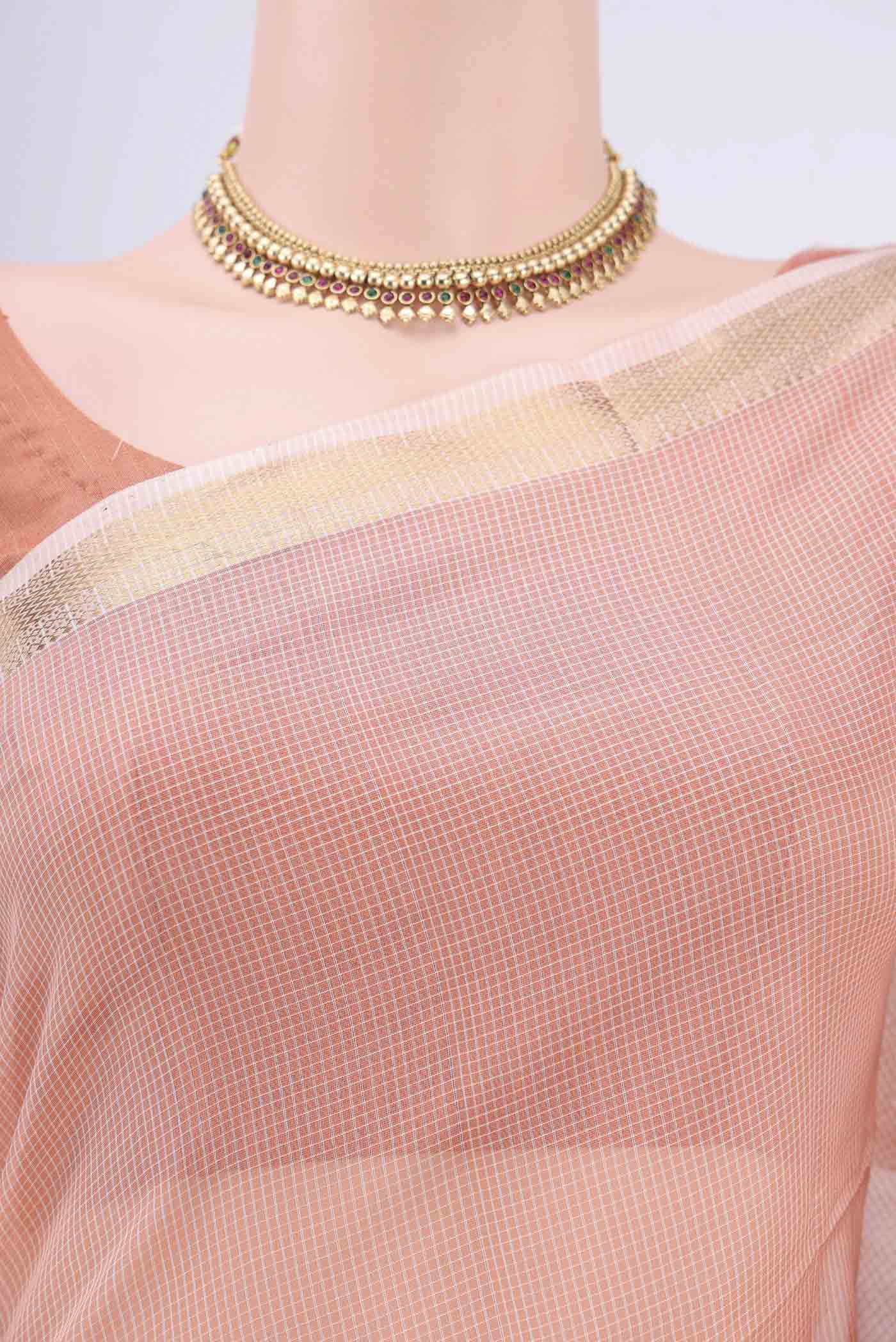 Border image of Peach Maheshwari Silk Cotton Saree with Plain Body and Zari Border. 