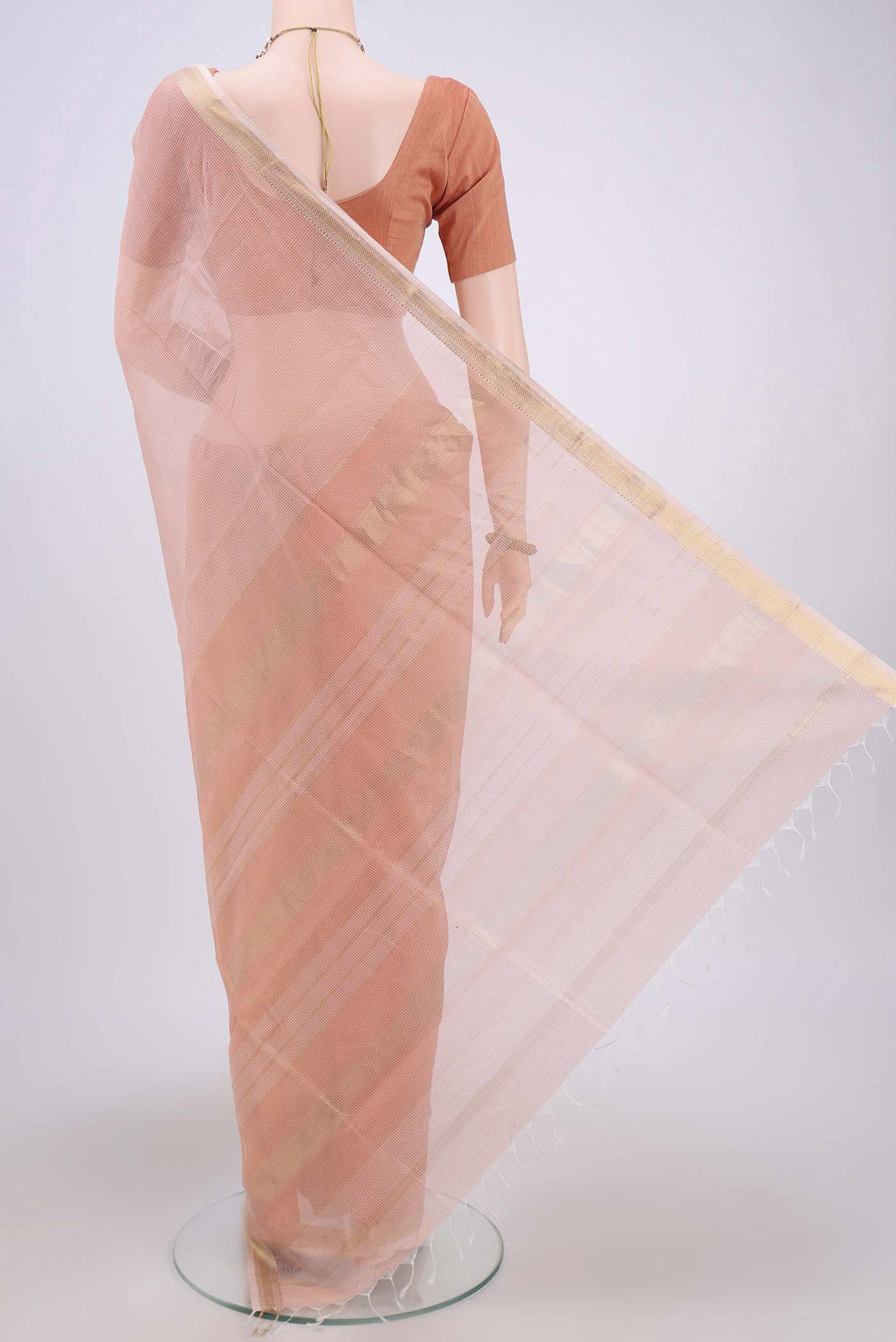Flat view of Peach Maheshwari Silk Cotton Saree with Plain Body and Zari Border. 