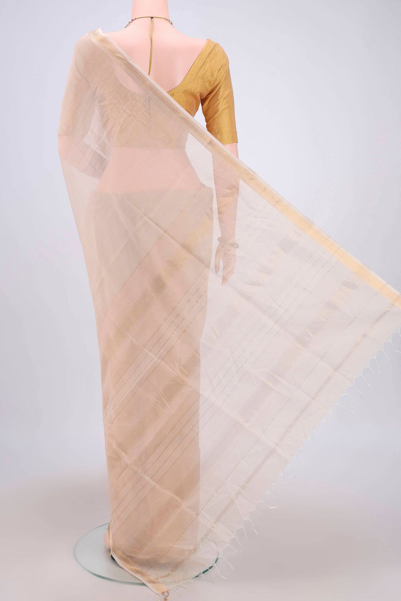 Flat view of Off White Maheshwari Silk Cotton Saree with Plain Body and Zari Border. 