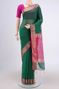 Bottle Green Maheshwari Silk Cotton Saree with Zari And Thread Butta on the body and Zari Border.  displayed on a mannequin