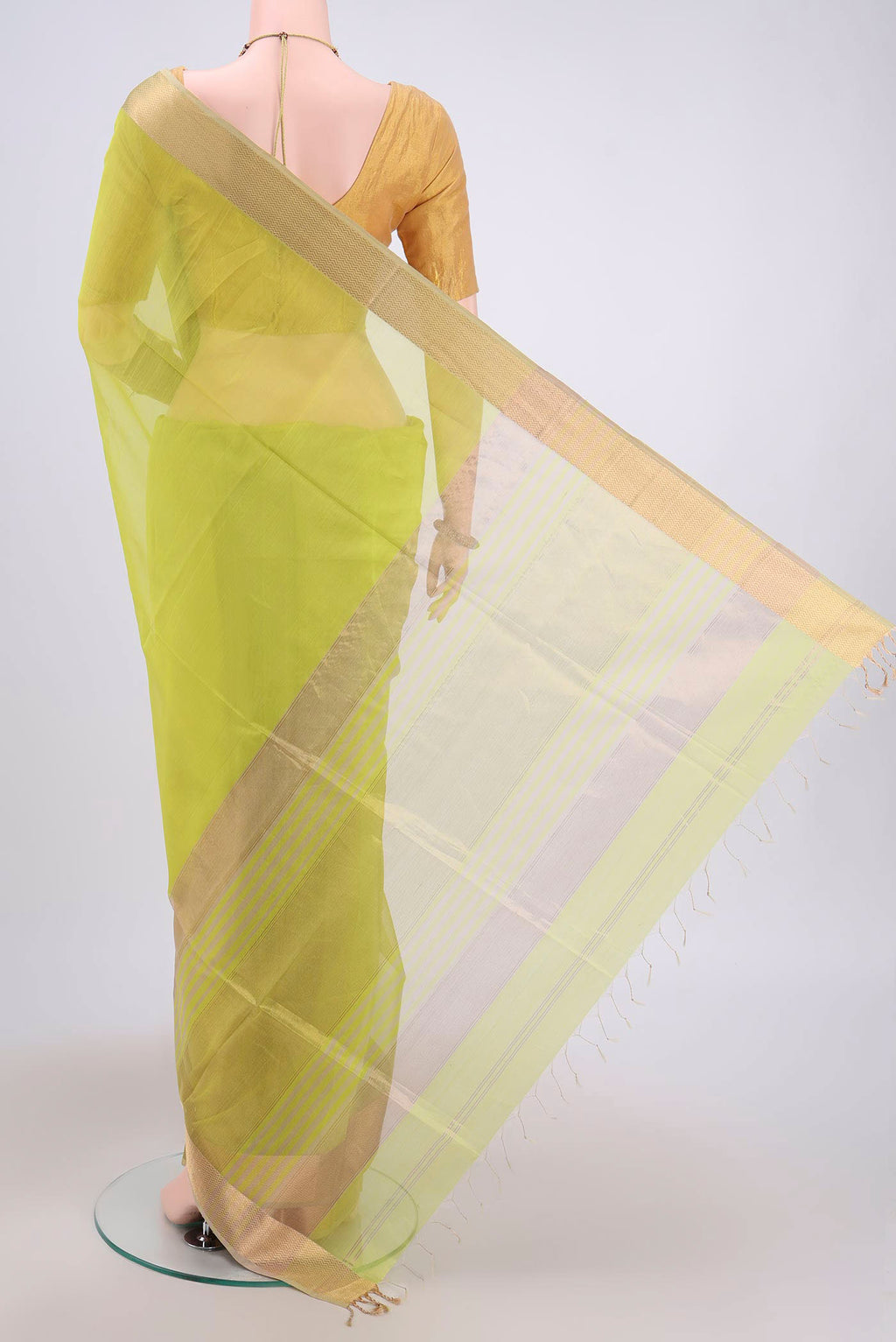 Flat view of Parrot Green Maheshwari Silk Cotton Saree with Plain Body and Zari Border. 