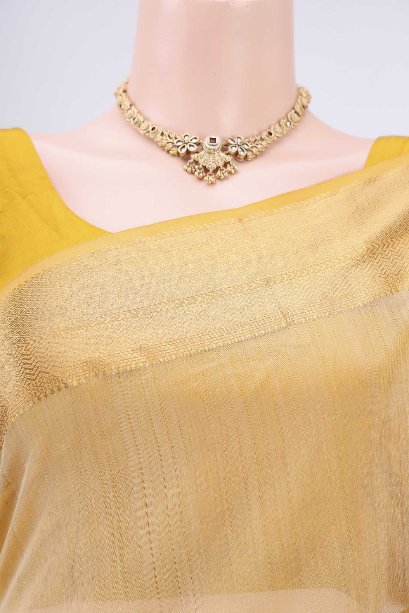Border image of Cream Dual Tone Maheshwari Silk Cotton Saree with Plain Body and Zari Border. 