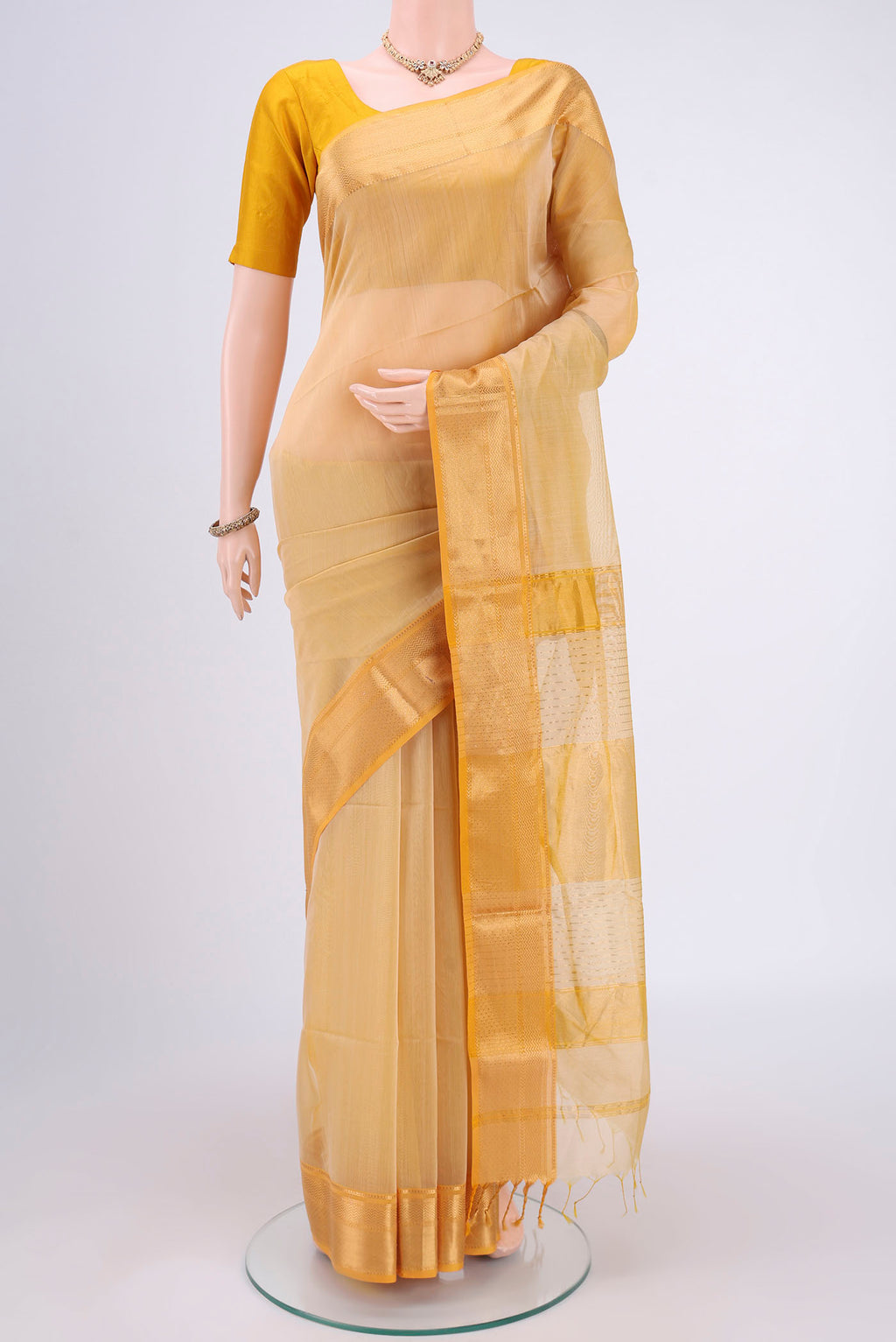 Cream Dual Tone Maheshwari Silk Cotton Saree with Plain Body and Zari Border.  displayed on a mannequin