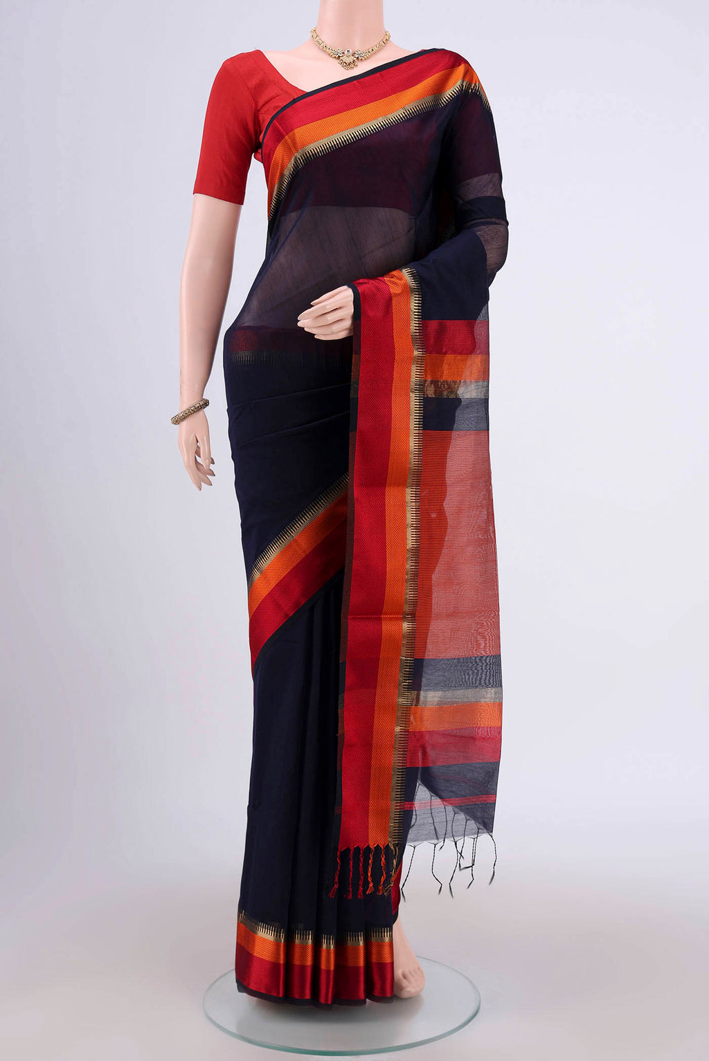 Navy Blue Maheshwari Silk Cotton Saree with Stripes on the body and Zari Border.  displayed on a mannequin