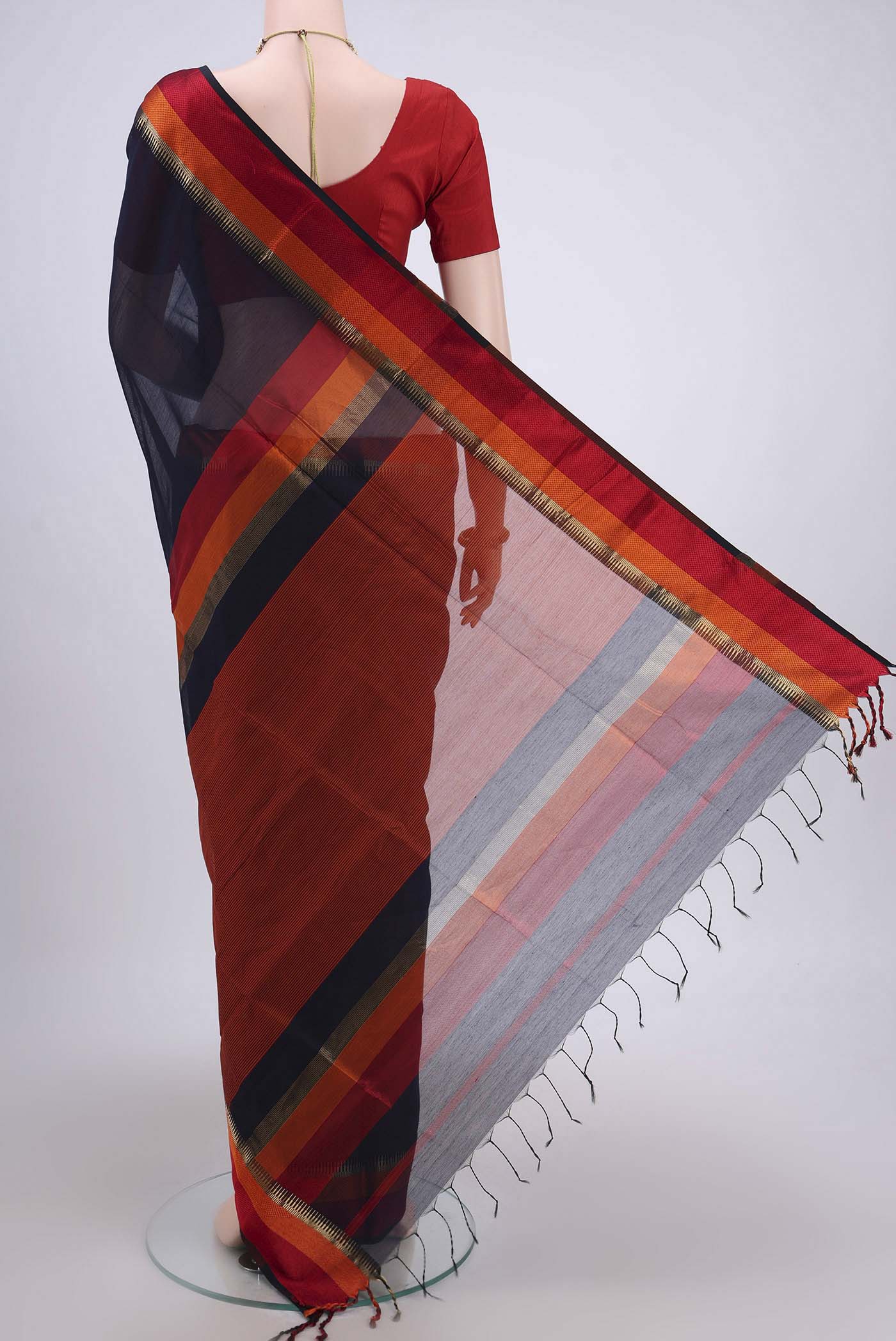 Flat view of Navy Blue Maheshwari Silk Cotton Saree with Stripes on the body and Zari Border. 