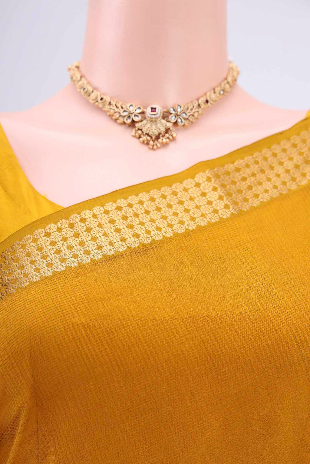 Border image of Mustard Maheshwari Silk Cotton Saree with Stripes on the body and Zari Border. 