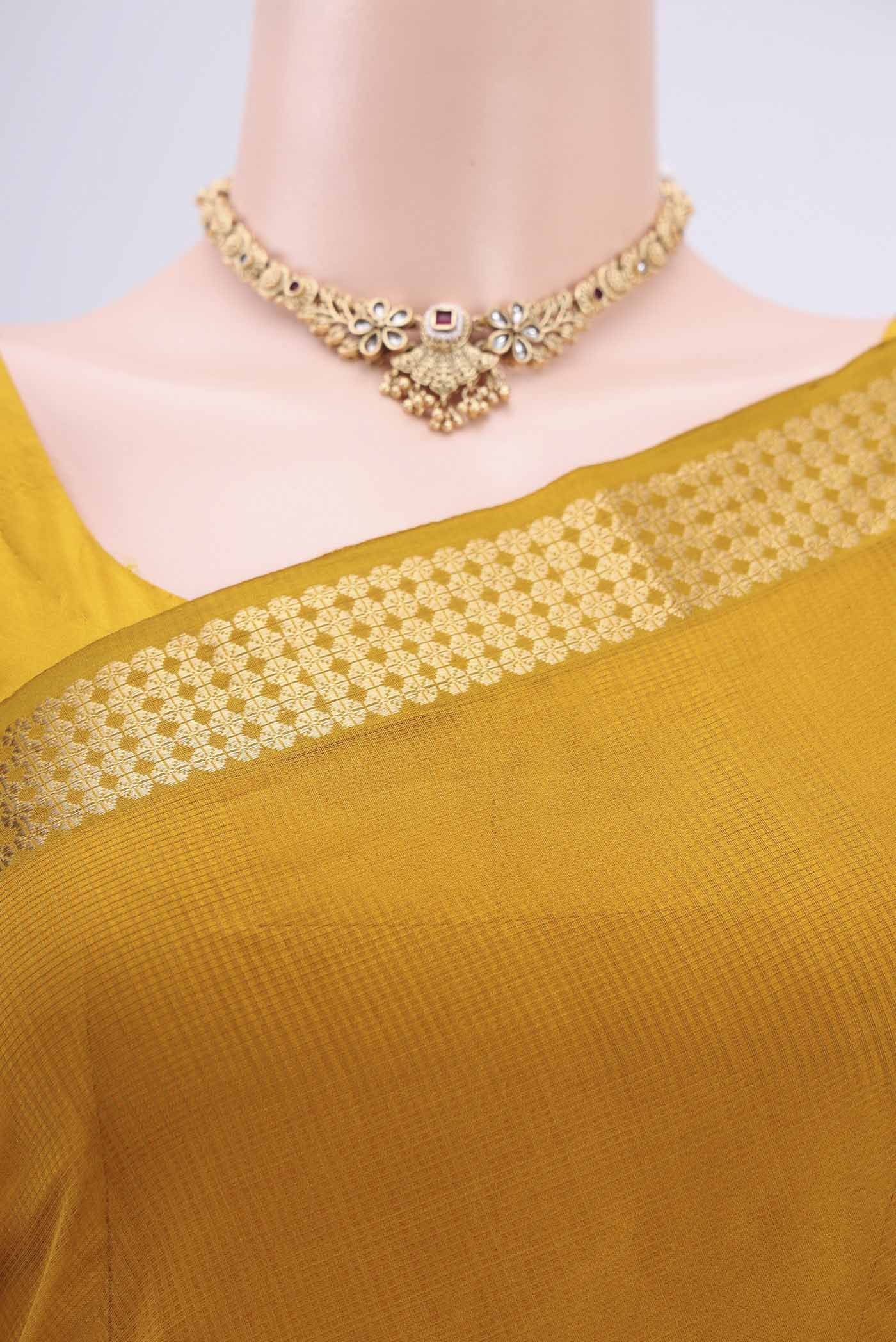 Border image of Mustard Maheshwari Silk Cotton Saree with Stripes on the body and Zari Border. 