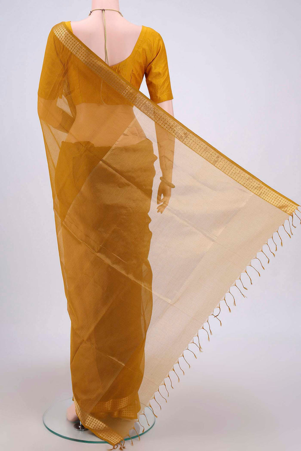 Flat view of Mustard Maheshwari Silk Cotton Saree with Stripes on the body and Zari Border. 
