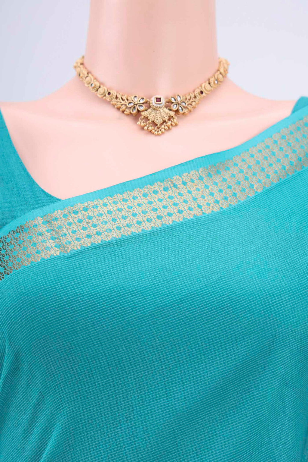 Border image of Turquoise Maheshwari Silk Cotton Saree with Plain Body and Zari Border. 