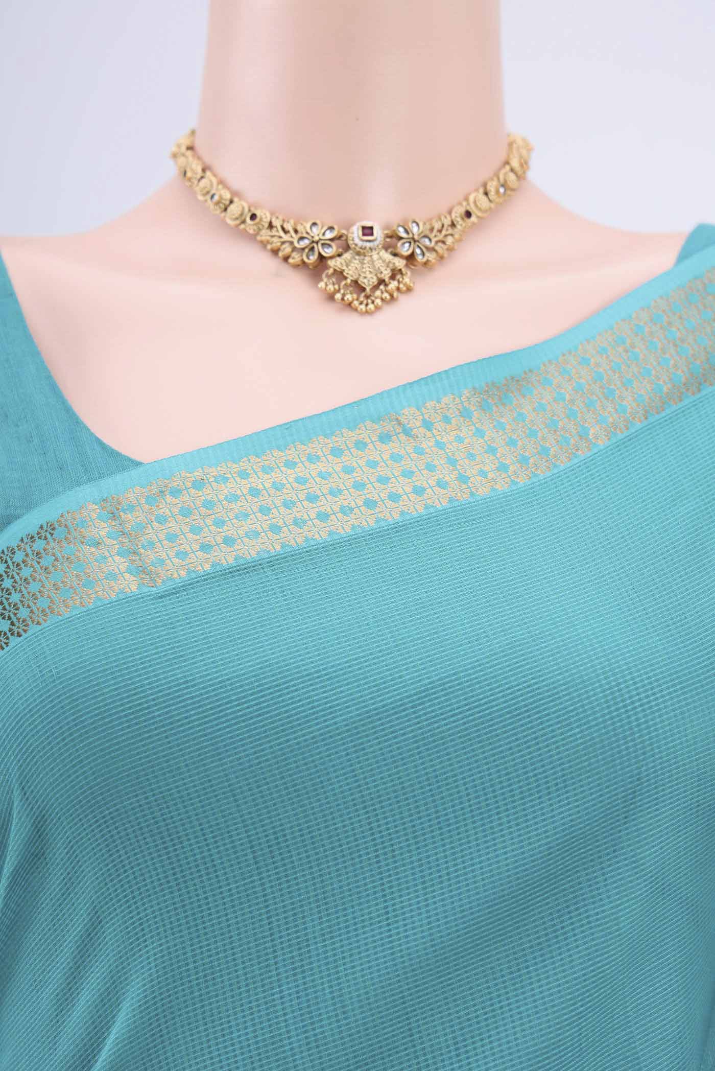 Border image of Turquoise Maheshwari Silk Cotton Saree with Plain Body and Zari Border. 