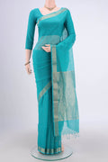 Turquoise Maheshwari Silk Cotton Saree with Plain Body and Zari Border.  displayed on a mannequin