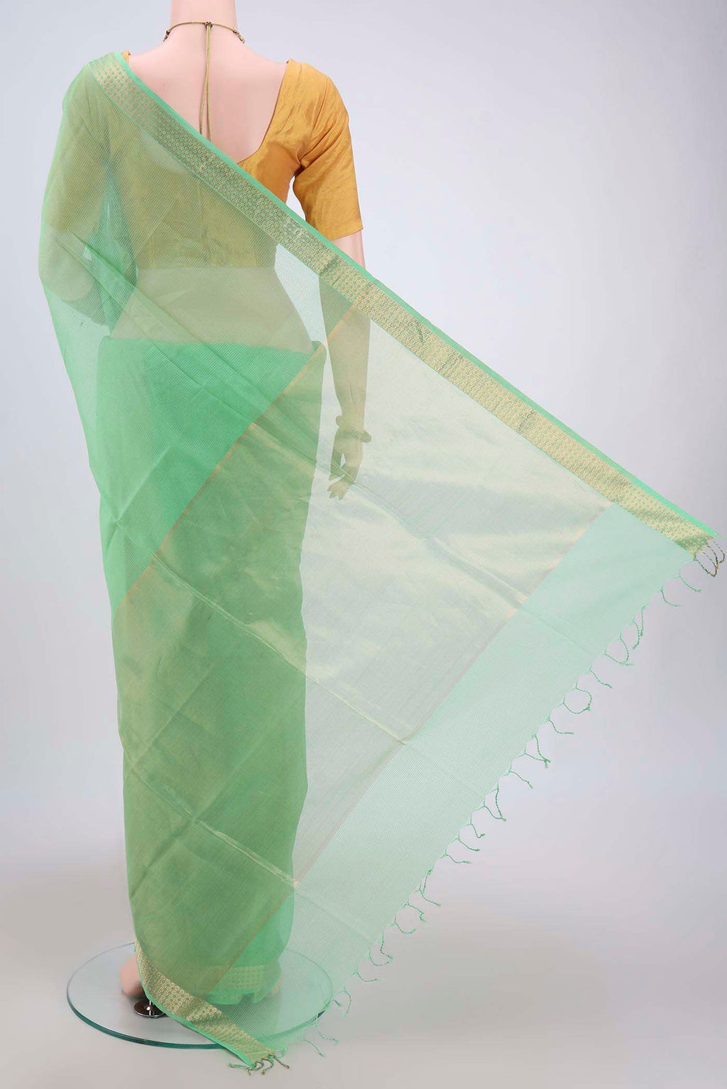Flat view of Light Green Maheshwari Silk Cotton Saree with Plain Body and Zari Border. 