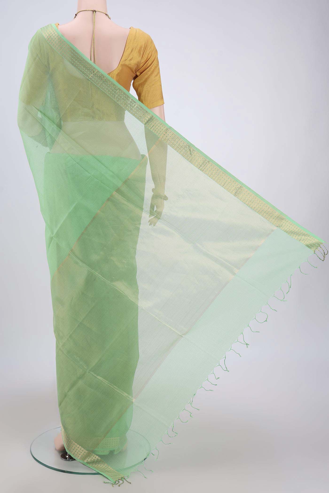 Flat view of Light Green Maheshwari Silk Cotton Saree with Plain Body and Zari Border. 