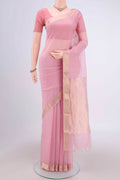 Pink Maheshwari Silk Cotton Saree with Plain Body and Zari Border.  displayed on a mannequin