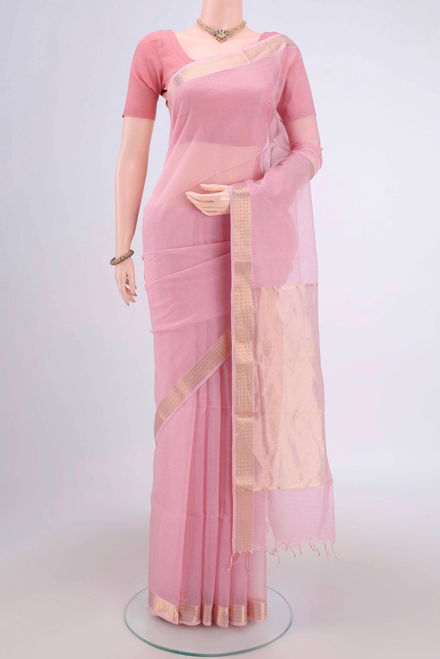 Pink Maheshwari Silk Cotton Saree with Plain Body and Zari Border.  displayed on a mannequin