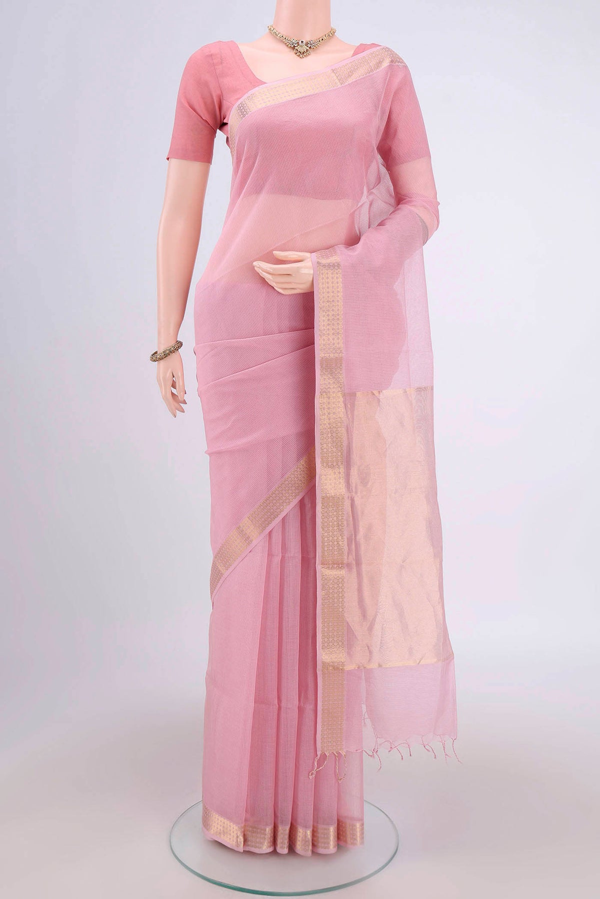 Pink Maheshwari Silk Cotton Saree with Plain Body and Zari Border.  displayed on a mannequin