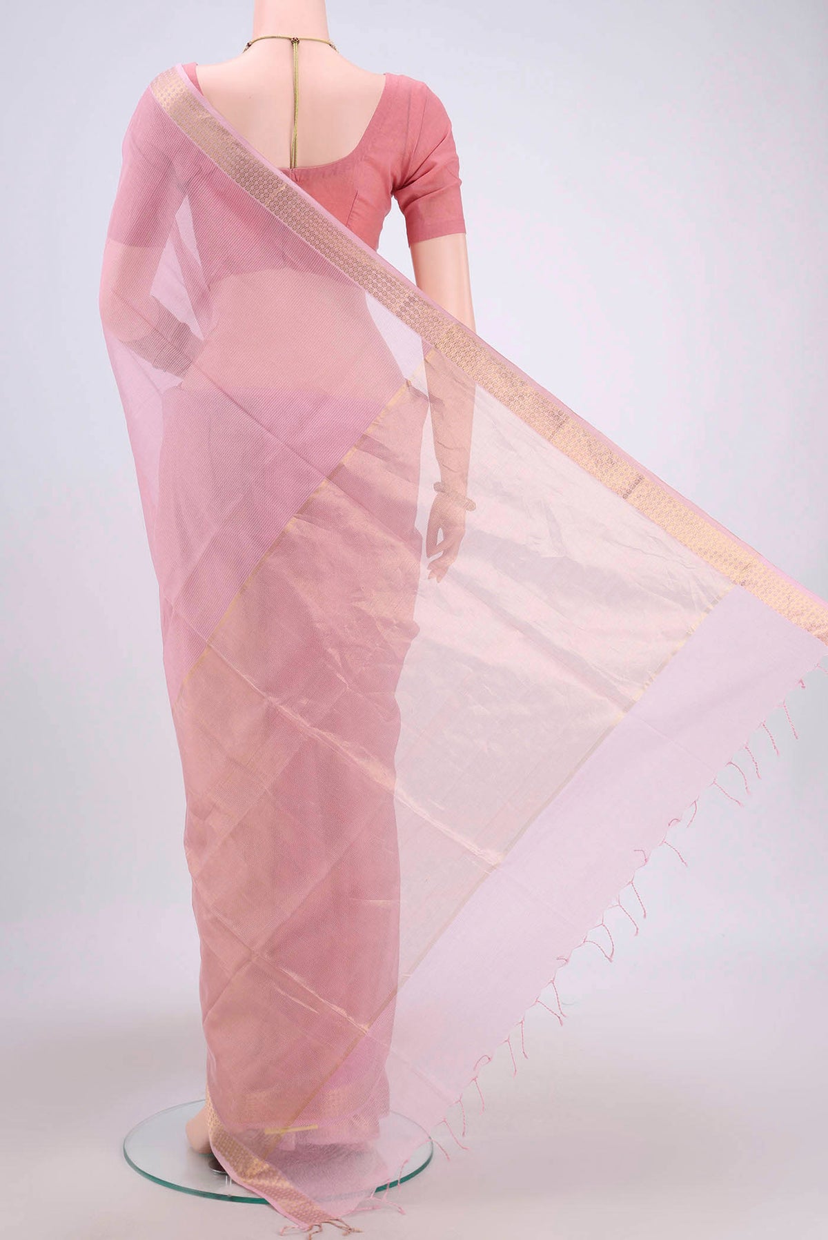 Flat view of Pink Maheshwari Silk Cotton Saree with Plain Body and Zari Border. 