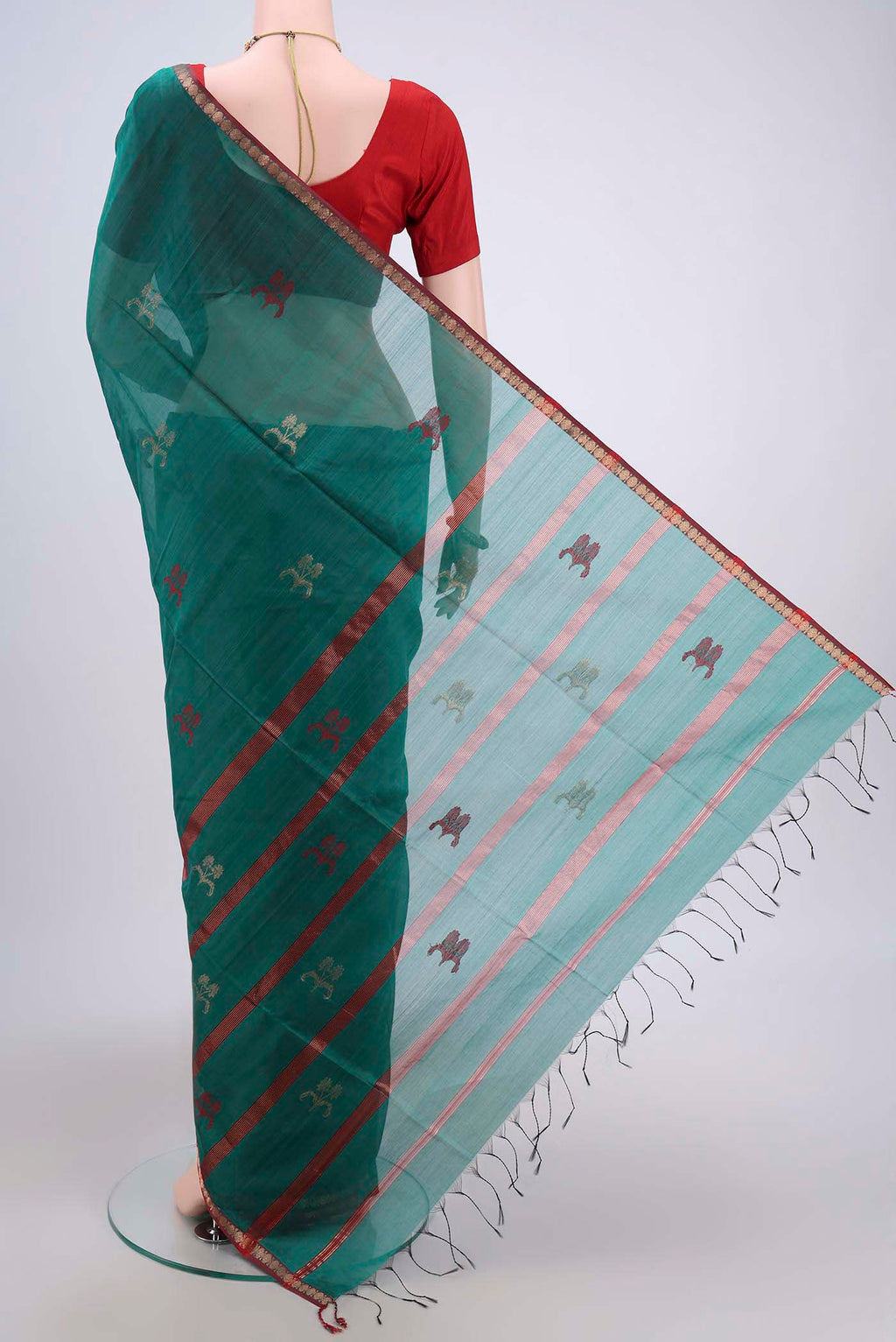 Flat view of Sea Green Maheshwari Silk Cotton Saree with Zari And Thread Butta on the body and Zari Border. 