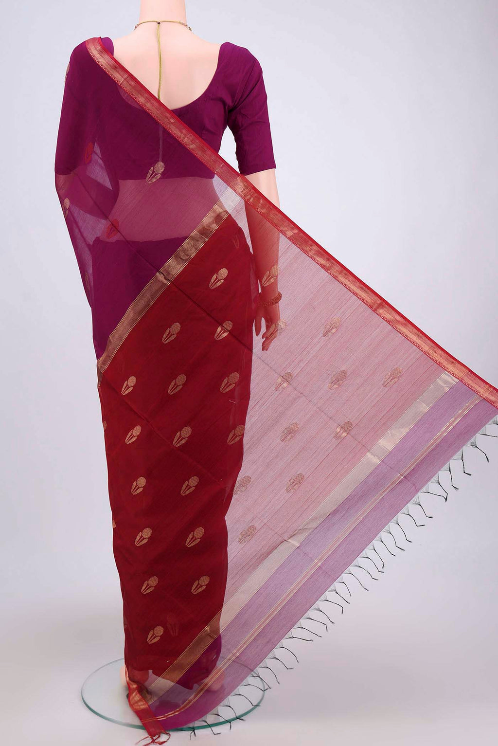 Flat view of Magenta Maheshwari Silk Cotton Saree with Plain Body and Zari Border. 