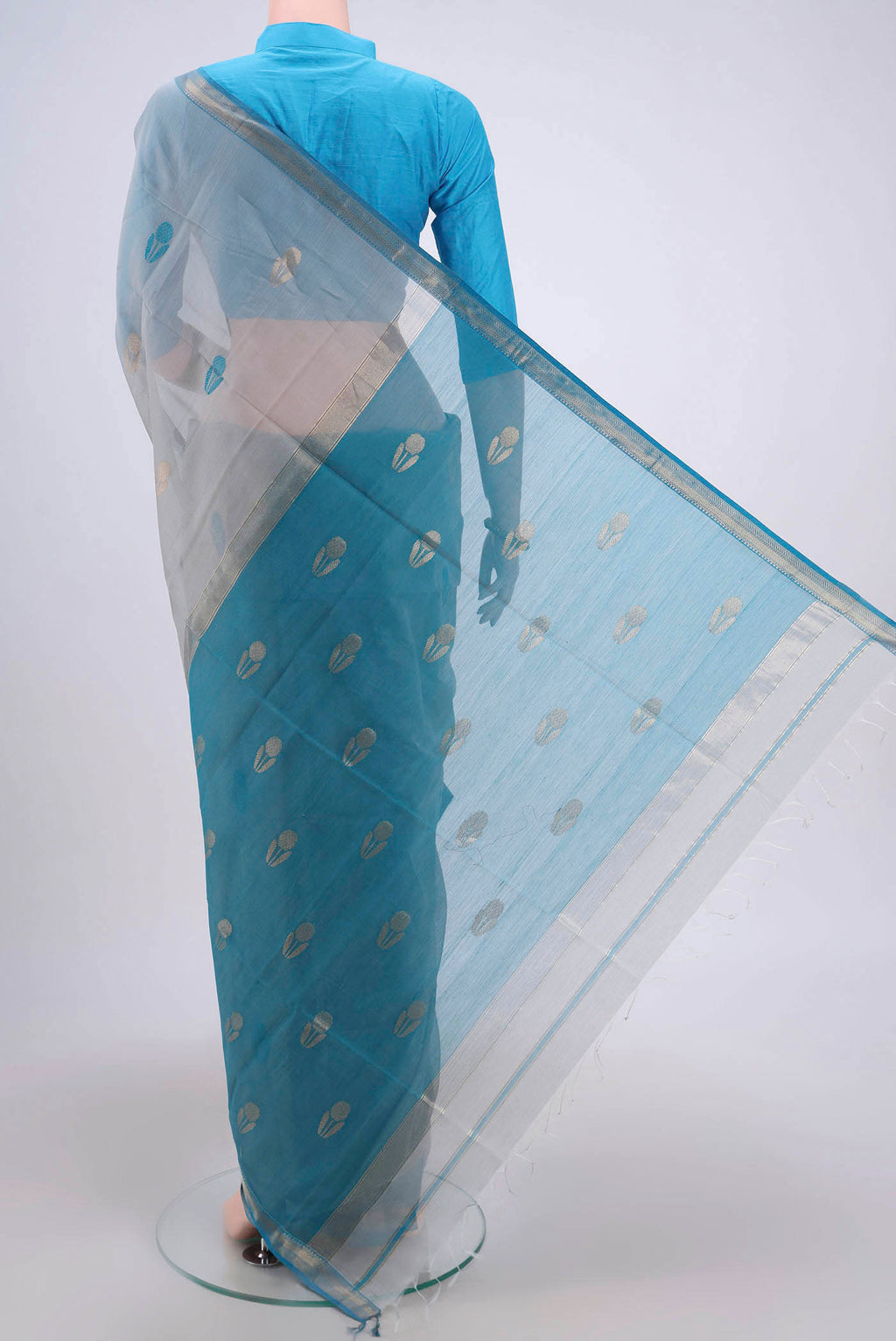 Flat view of Grey Maheshwari Silk Cotton Saree with Stripes on the body and Zari Border. 