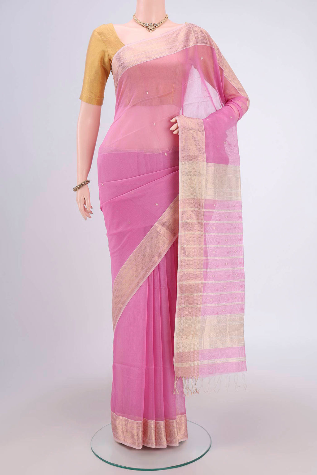 Pink Maheshwari Silk Cotton Saree with Plain Body and Zari Border.  displayed on a mannequin