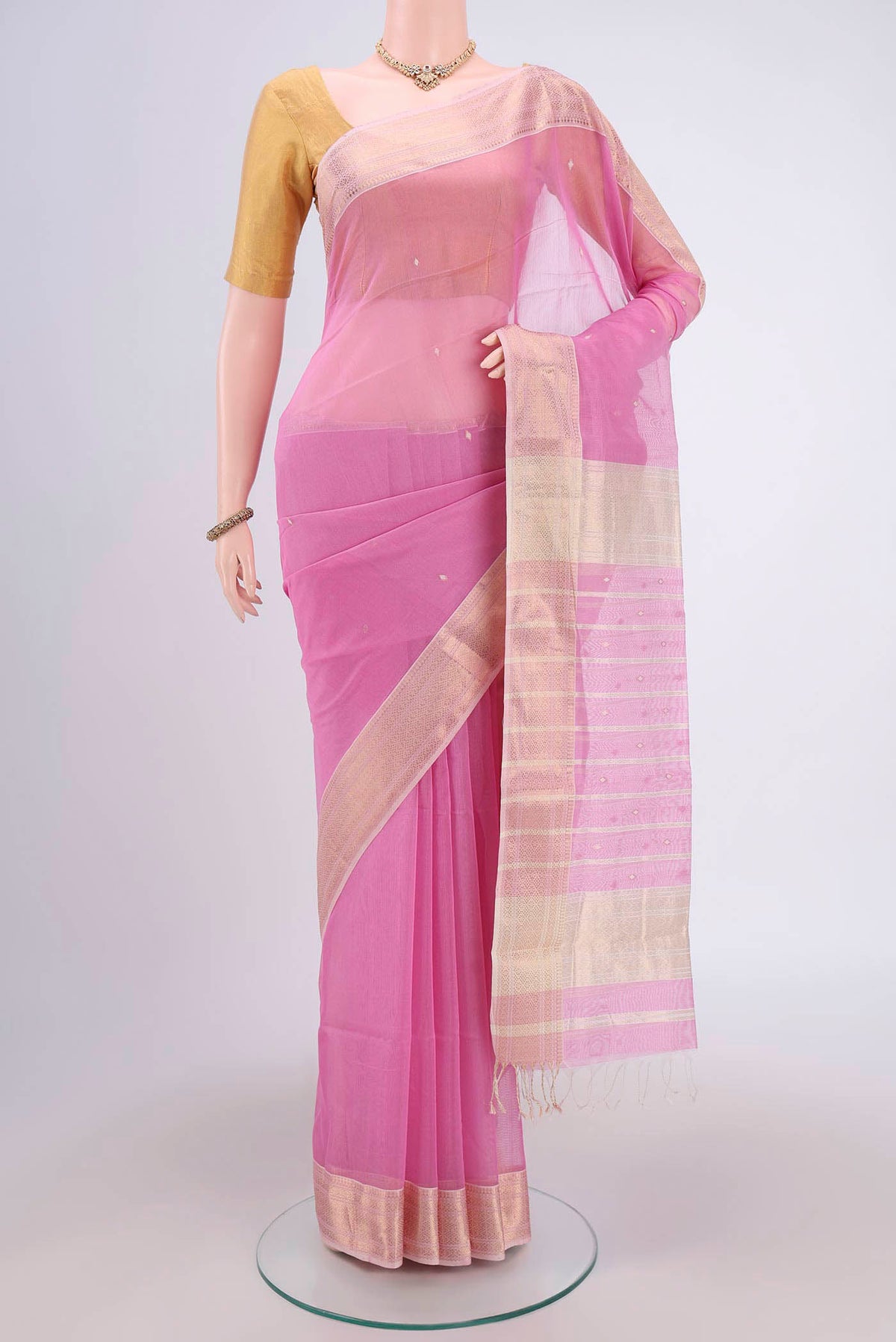 Pink Maheshwari Silk Cotton Saree with Plain Body and Zari Border.  displayed on a mannequin
