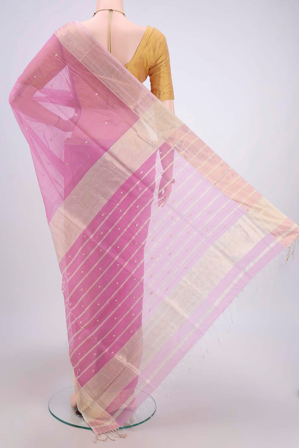 Flat view of Pink Maheshwari Silk Cotton Saree with Plain Body and Zari Border. 