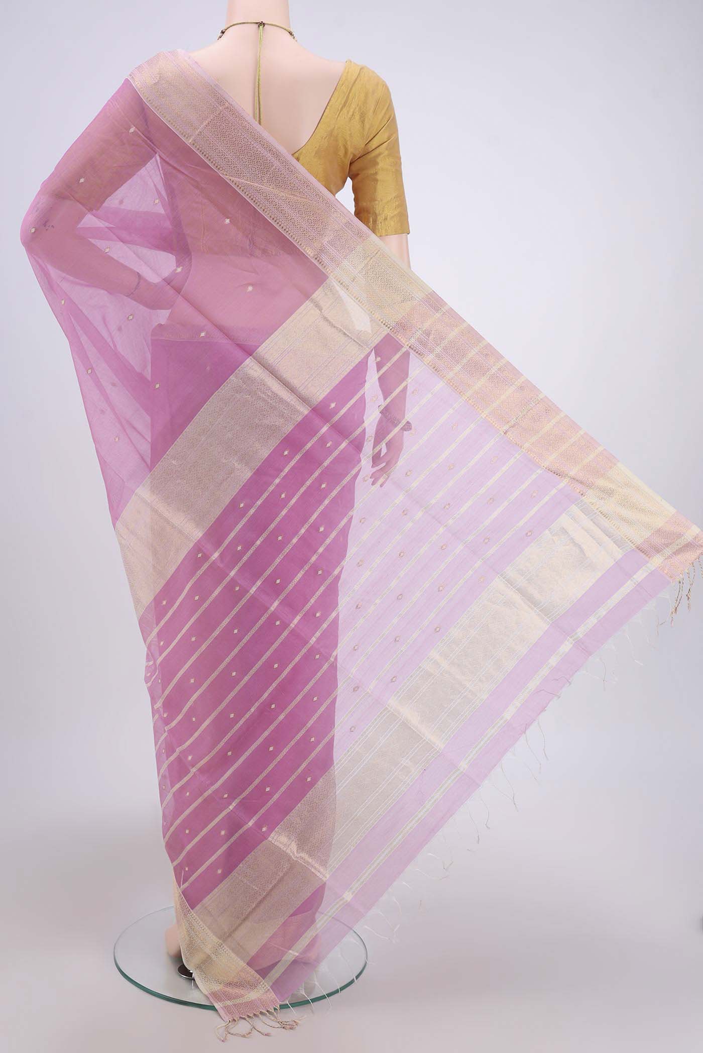 Flat view of Pink Maheshwari Silk Cotton Saree with Plain Body and Zari Border. 