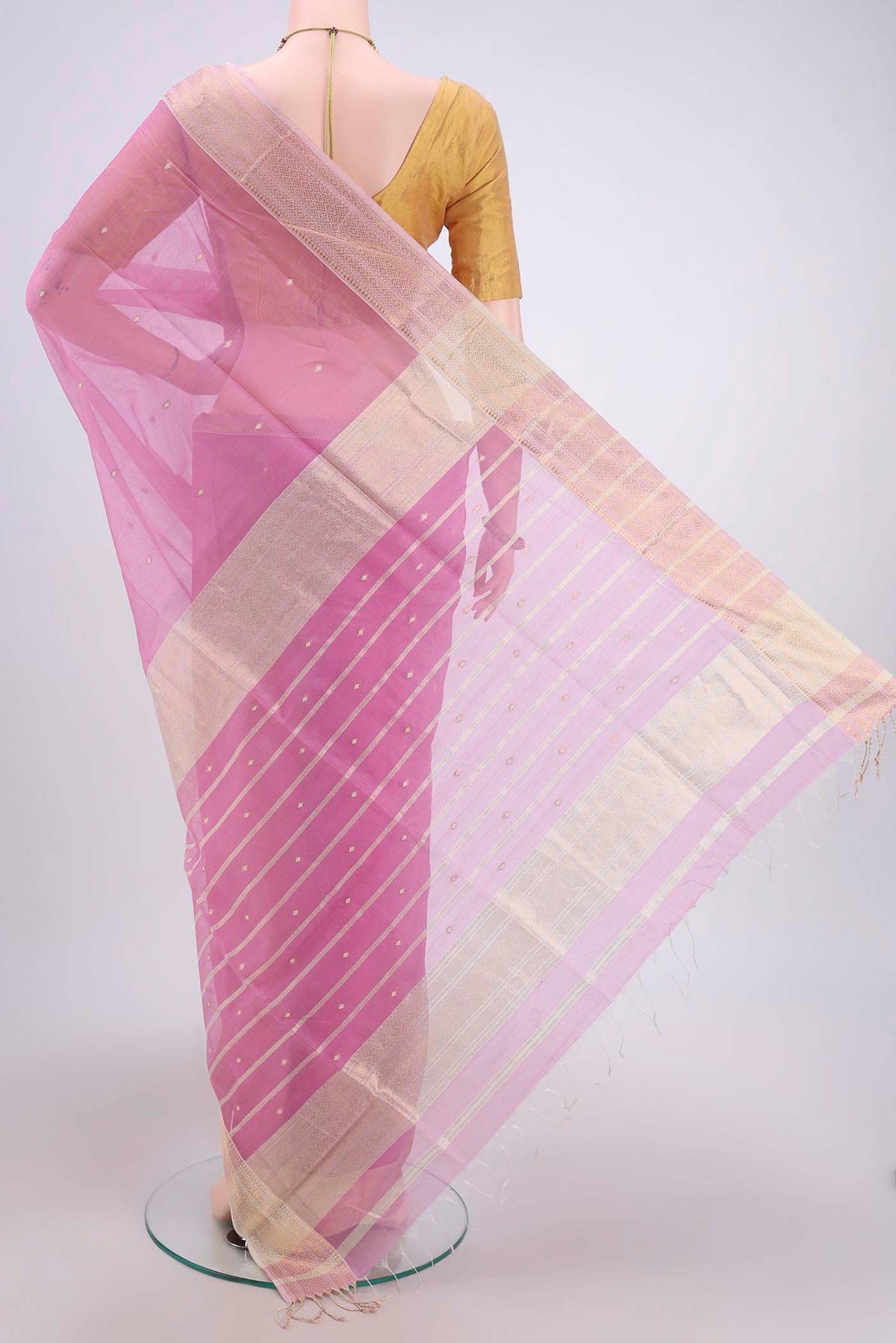 Flat view of Pink Maheshwari Silk Cotton Saree with Plain Body and Zari Border. 