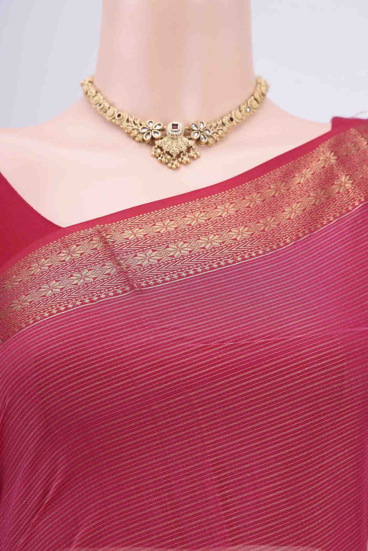 Border image of Dark Pink Maheshwari Silk Cotton Saree with Stripes on the body and Zari Border. 