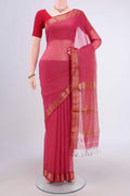 Dark Pink Maheshwari Silk Cotton Saree with Stripes on the body and Zari Border.  displayed on a mannequin