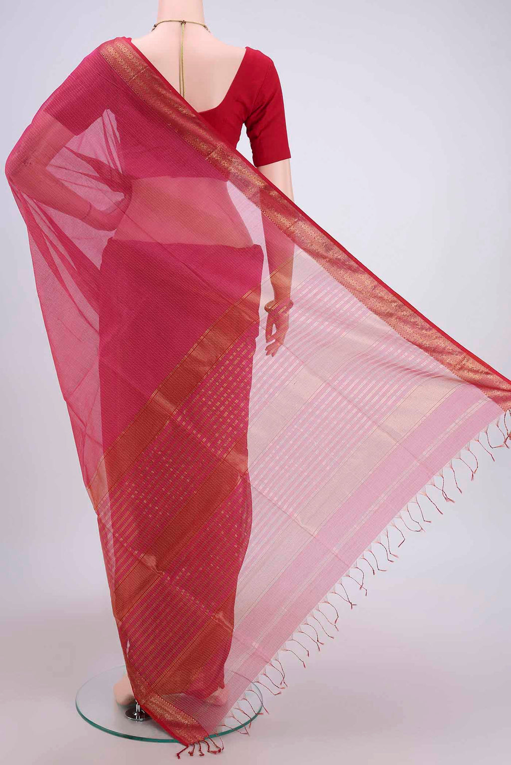 Flat view of Dark Pink Maheshwari Silk Cotton Saree with Stripes on the body and Zari Border. 